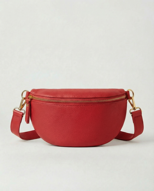 Red pebble leather fanny bag with adjustable strap and compact, hands‑free design.