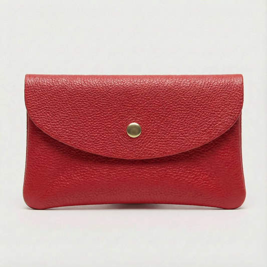 Red  pebble leather coin wallet with snap closure, minimalist Italian design, compact and elegant everyday accessory.