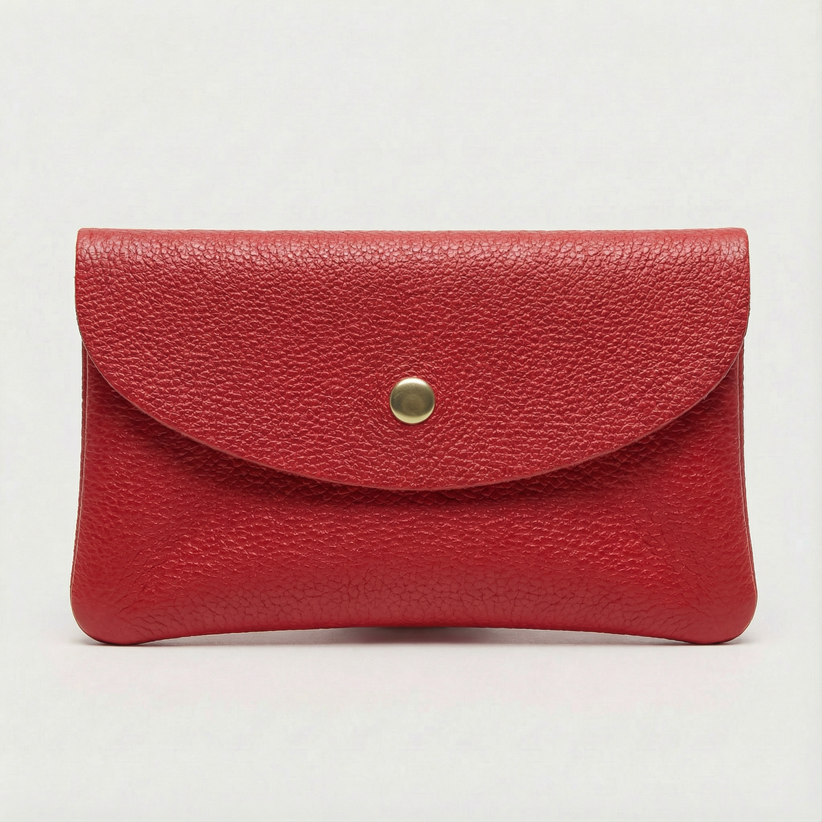 Red pebble leather wallet collection featuring Mini Coin Wallet, Coin Wallet, and Cellphone Wallet in genuine leather, made in Italy.