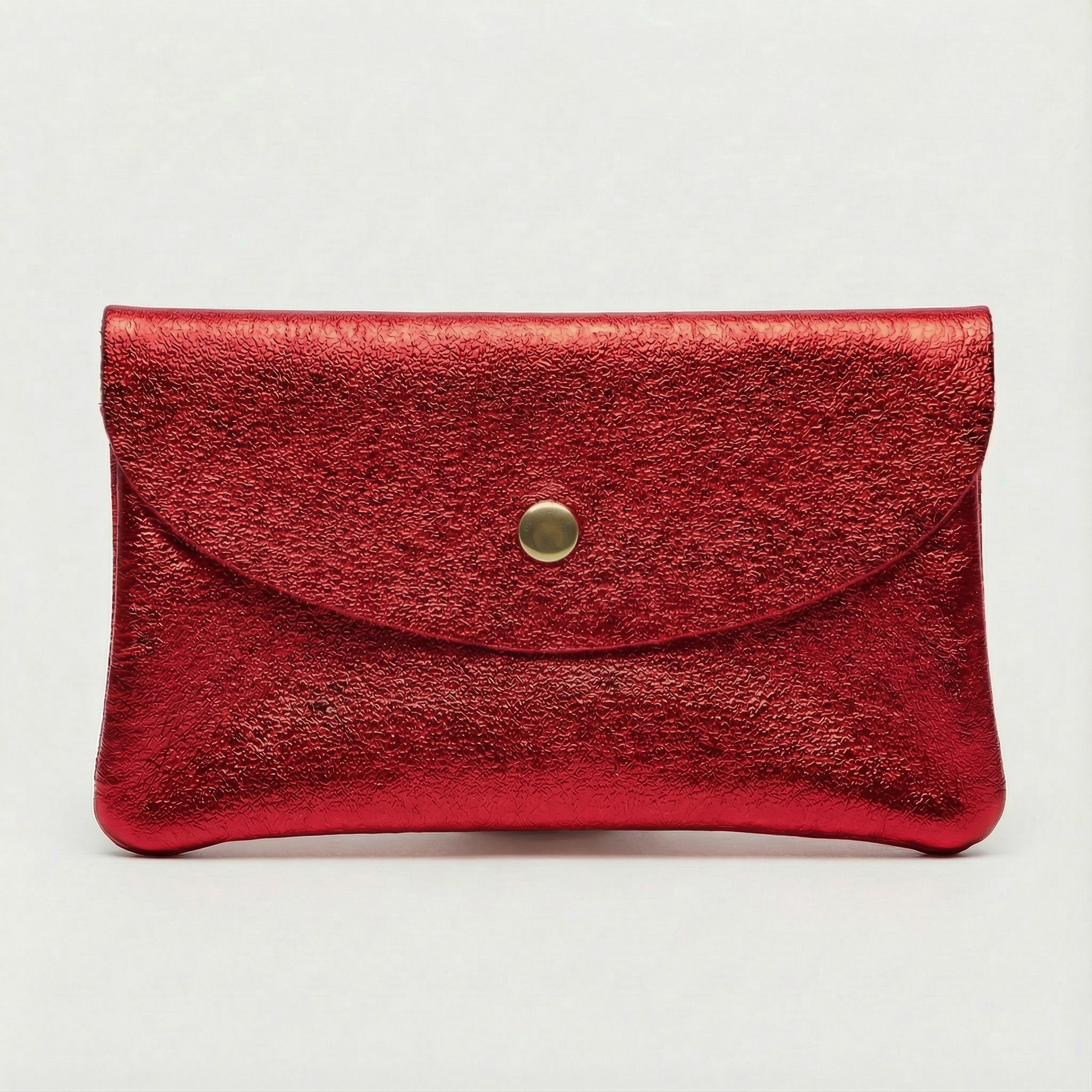 Red metallic leather coin wallet with textured finish, snap closure, compact Italian‑made design, stylish everyday accessory