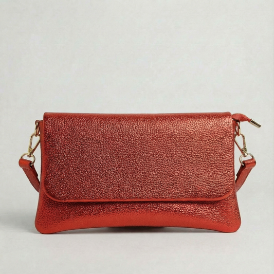 Red metallic leather crossbody bag with a matching color leather strap, displayed on a light gray background.