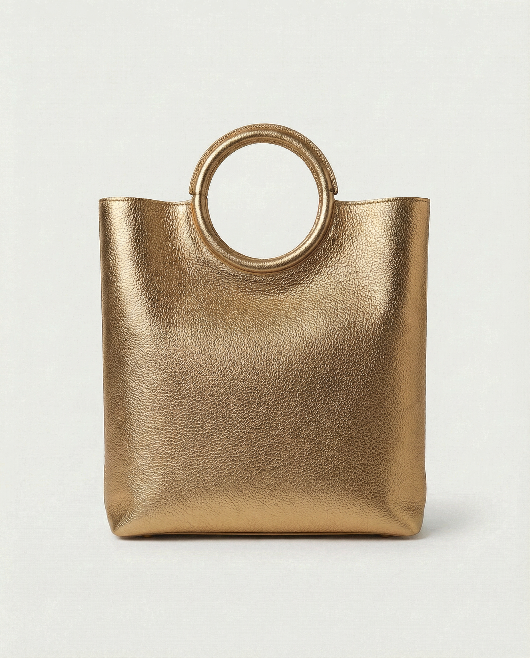 Metallic Antique Gold leather ring bag with circular top handle and structured silhouette, sleek and modern design.





