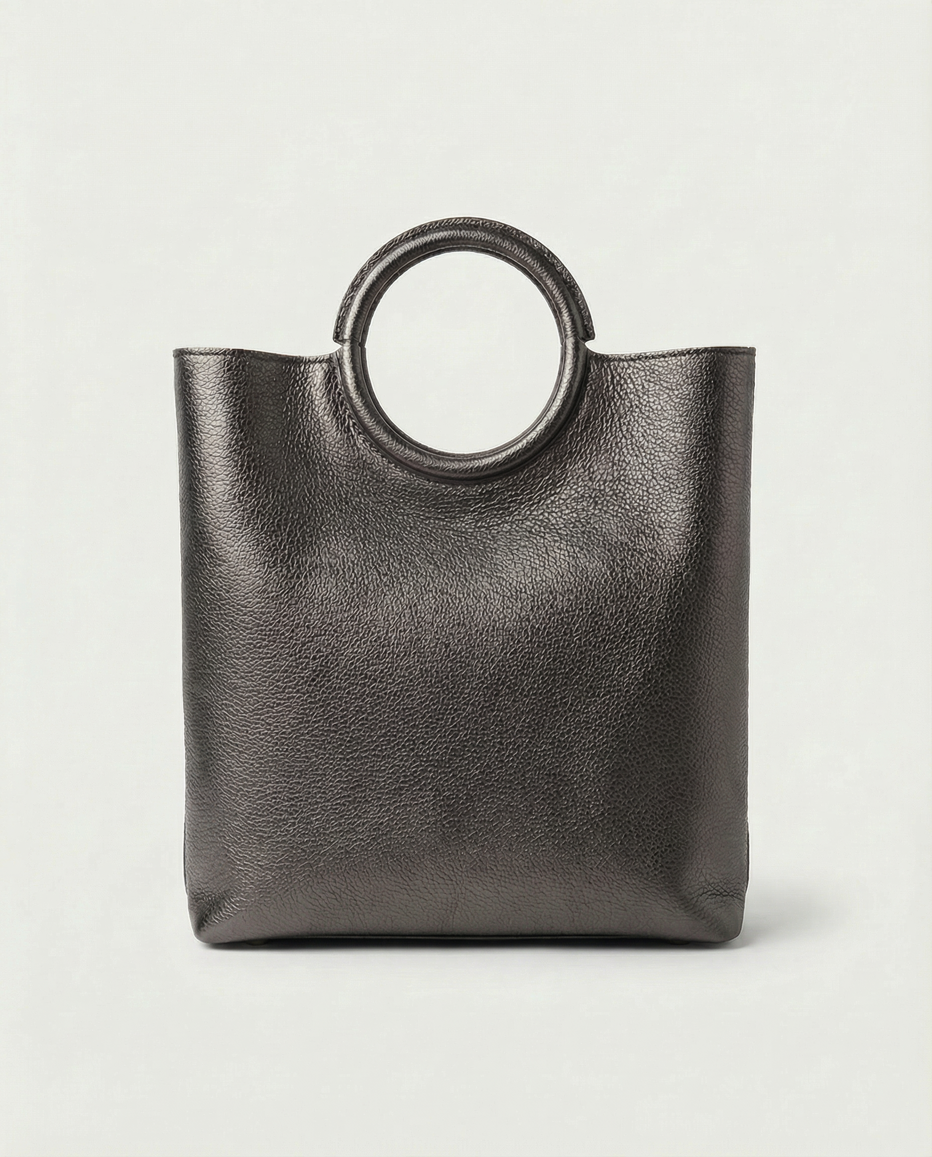 Metallic pewter leather ring bag with circular top handle and structured silhouette, sleek and modern design.