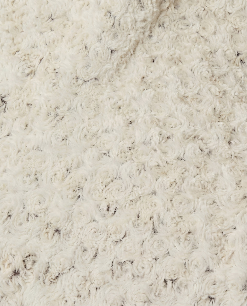 Close-up of a rosebud textured beige throw