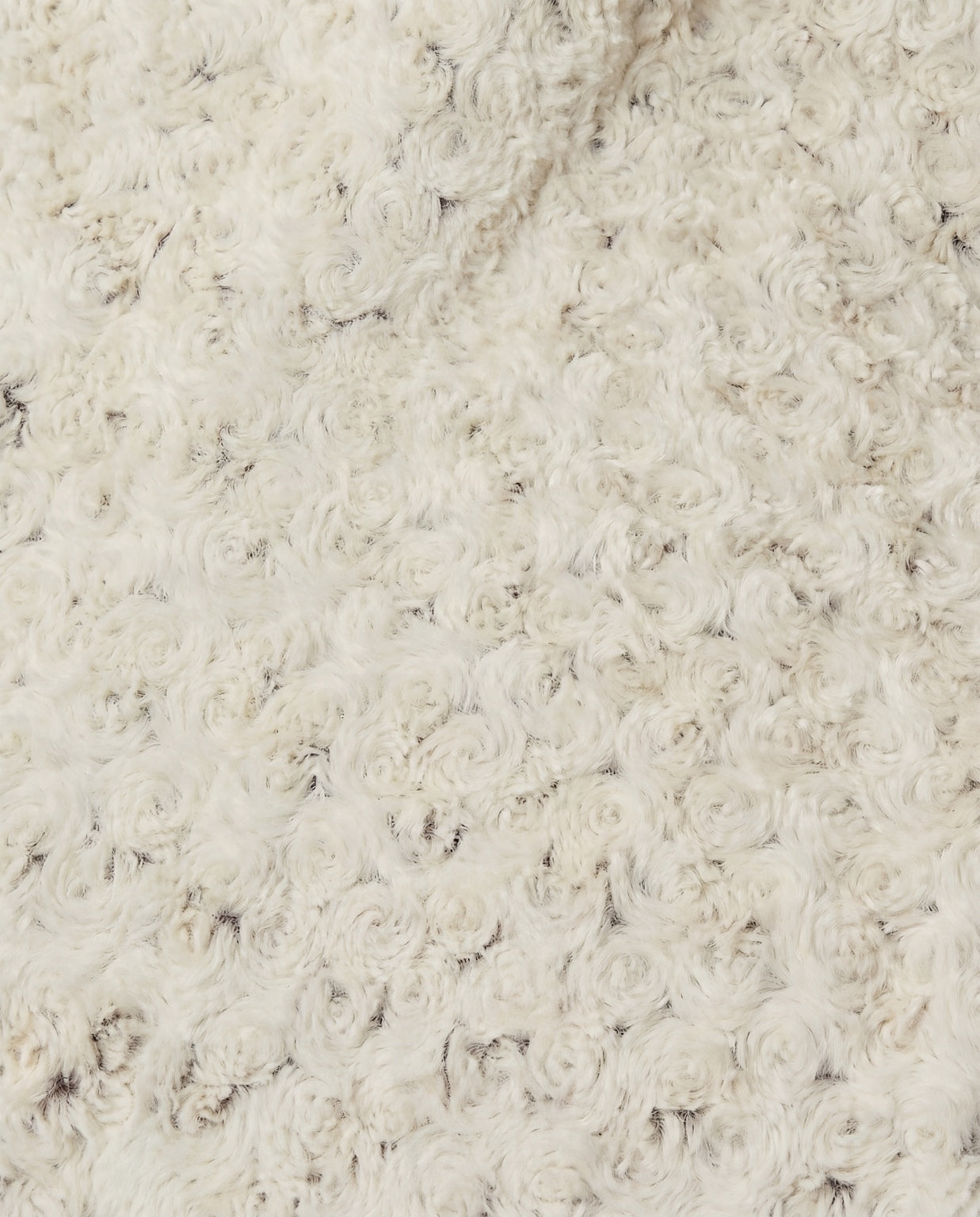 Close-up of a rosebud textured beige throw