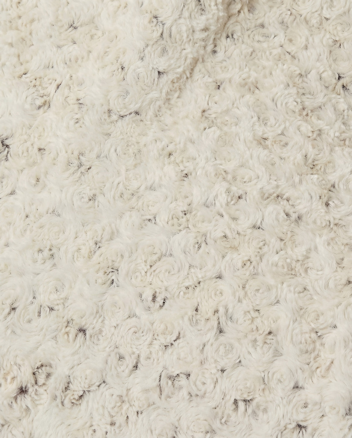 Rosebud Duotone Throw in Cream and Chocolate with a soft, plush texture.