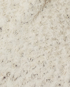 Close-up of a rosebud textured beige throw, view 1