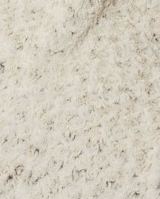 Close-up of a rosebud textured beige throw