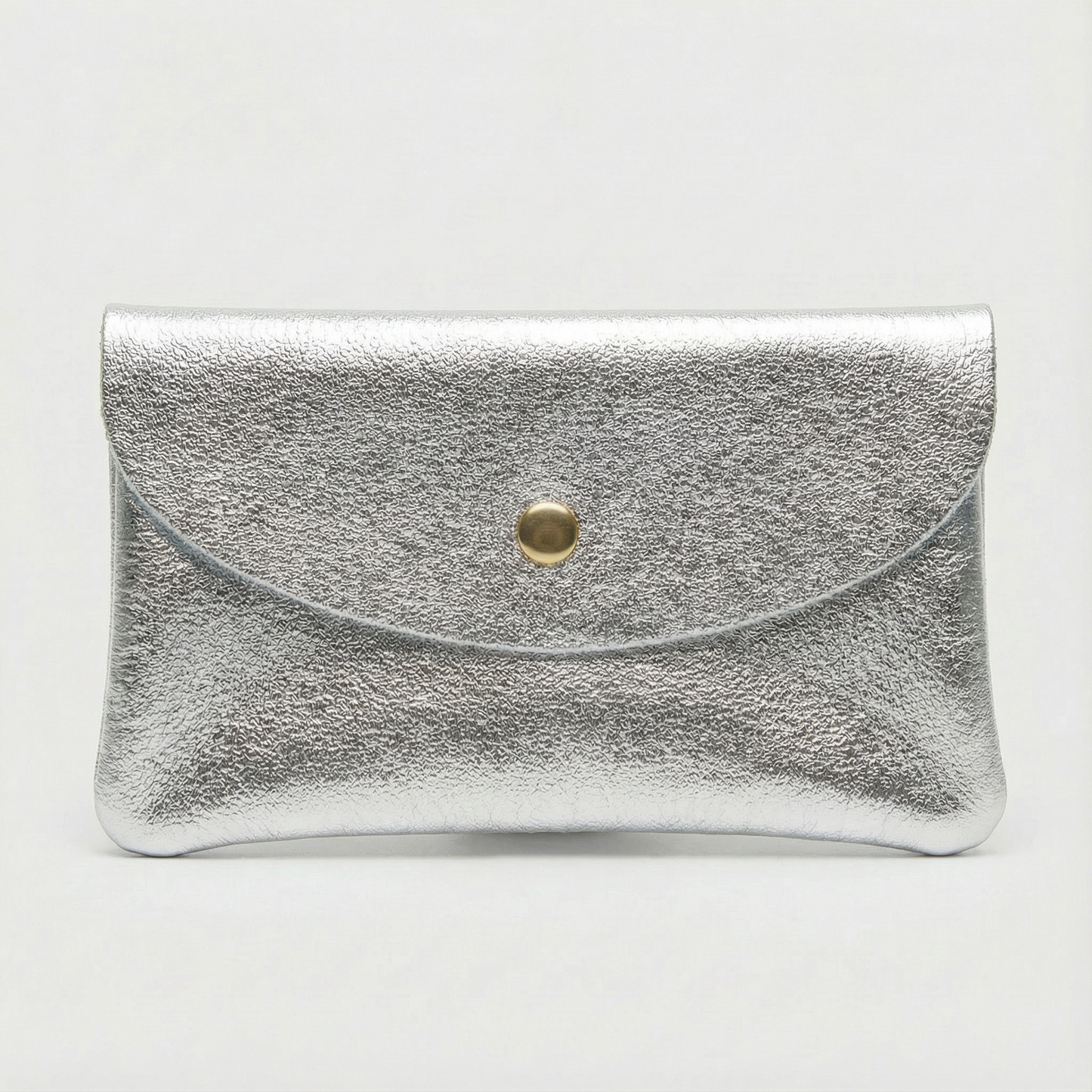 Silver metallic leather coin wallet with textured finish, snap closure, compact Italian‑made design, stylish everyday accessory