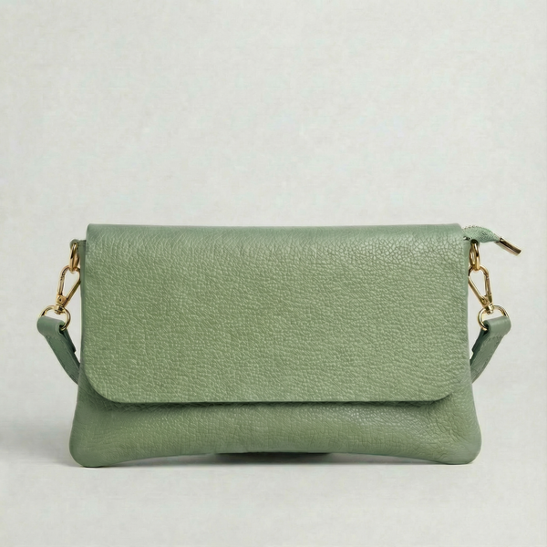 Spruce pebble leather crossbody bag with a matching color adjustable strap, displayed on a light gray background.