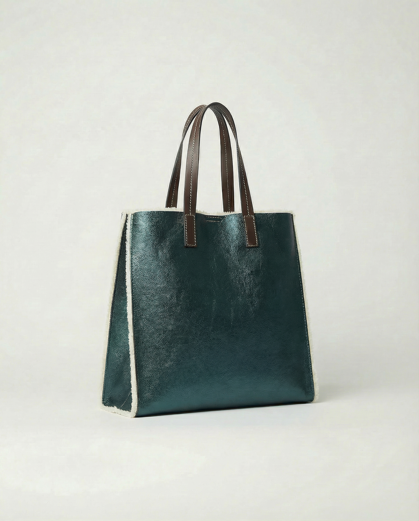 Metallic teal leather Paris tote bag available in Paris Tote and Mini Paris Tote sizes.
