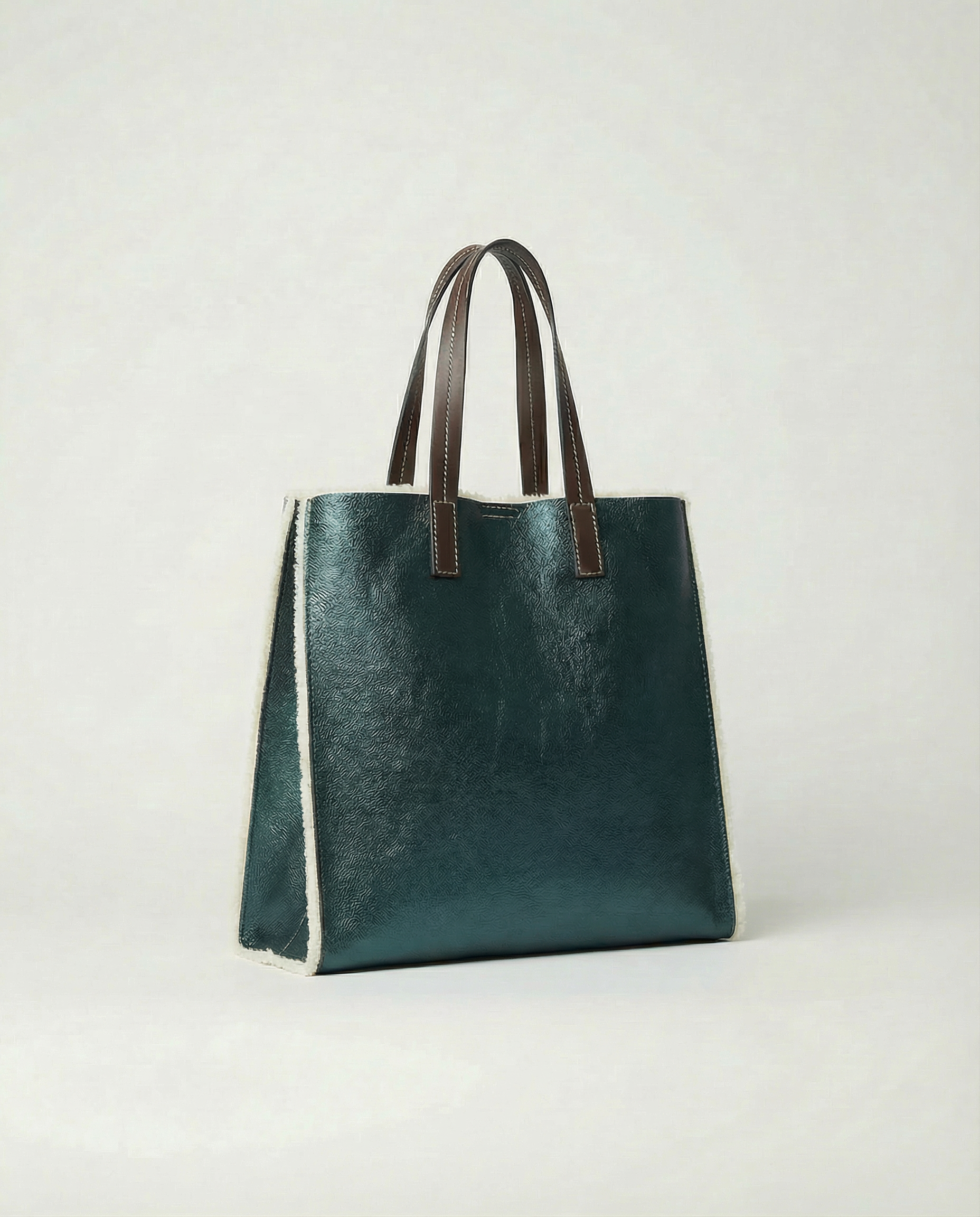 Metallic teal leather Paris tote bag available in Paris Tote and Mini Paris Tote sizes.
