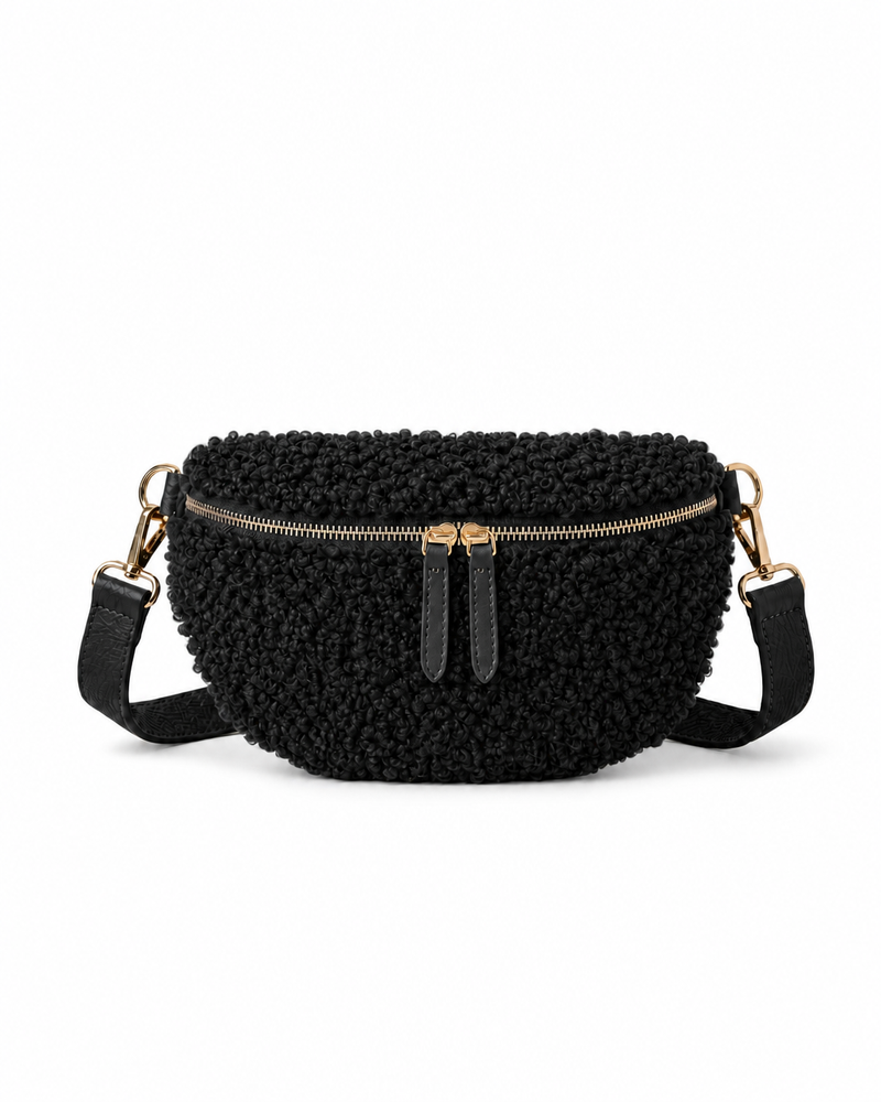 Stylish black teddy fabric and leather fanny bag with an adjustable strap.