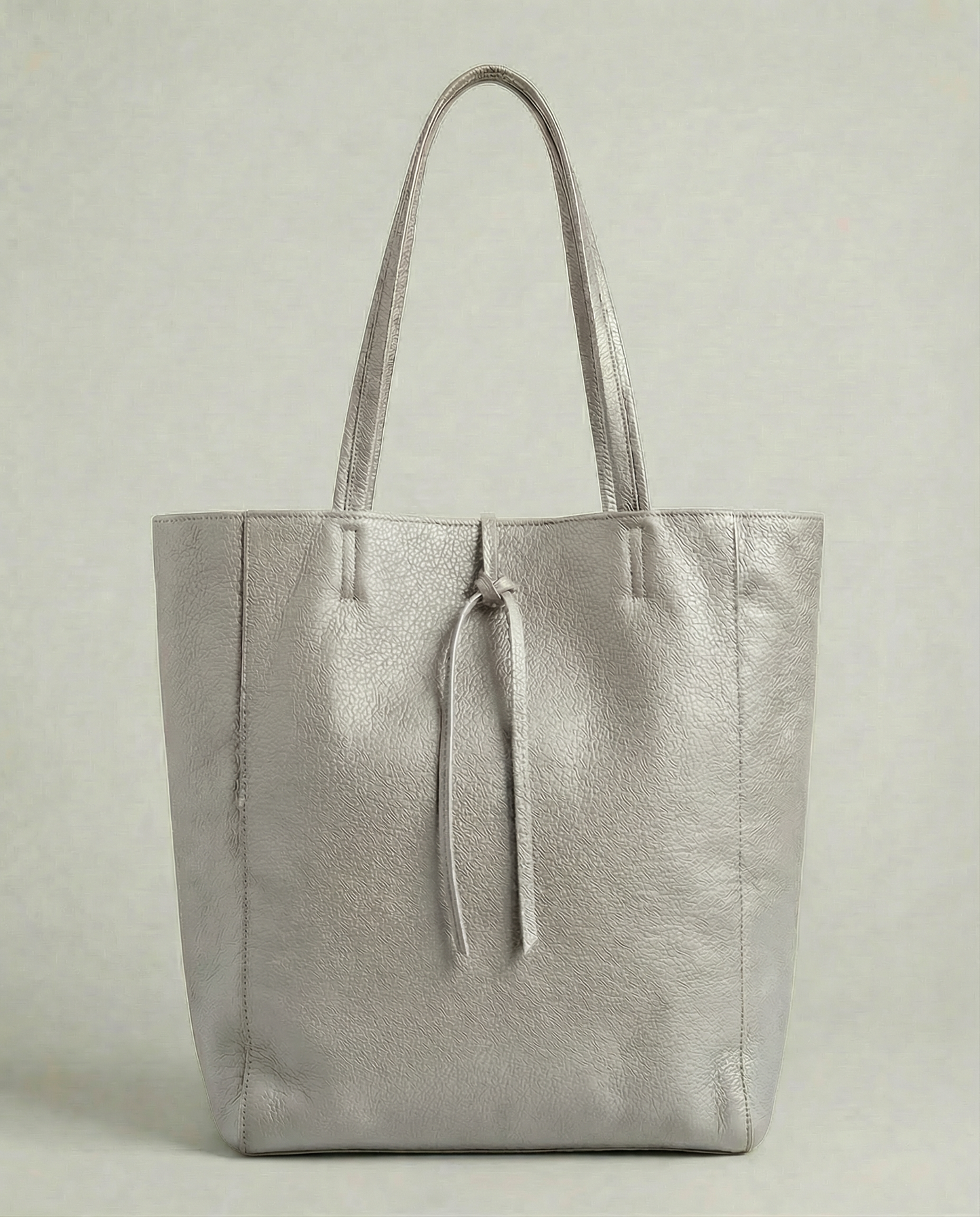 Platinum pebble leather tote bag available in Tote Bag and Mini Tote sizes. 