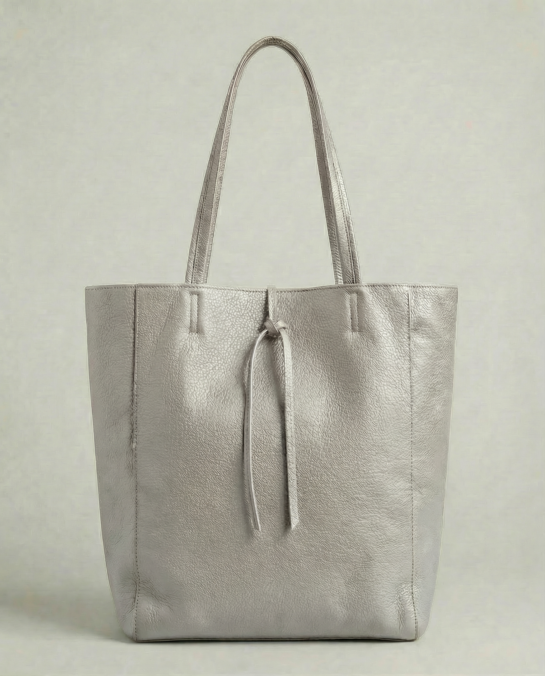 Platinum pebble leather tote bag available in Tote Bag and Mini Tote sizes. 