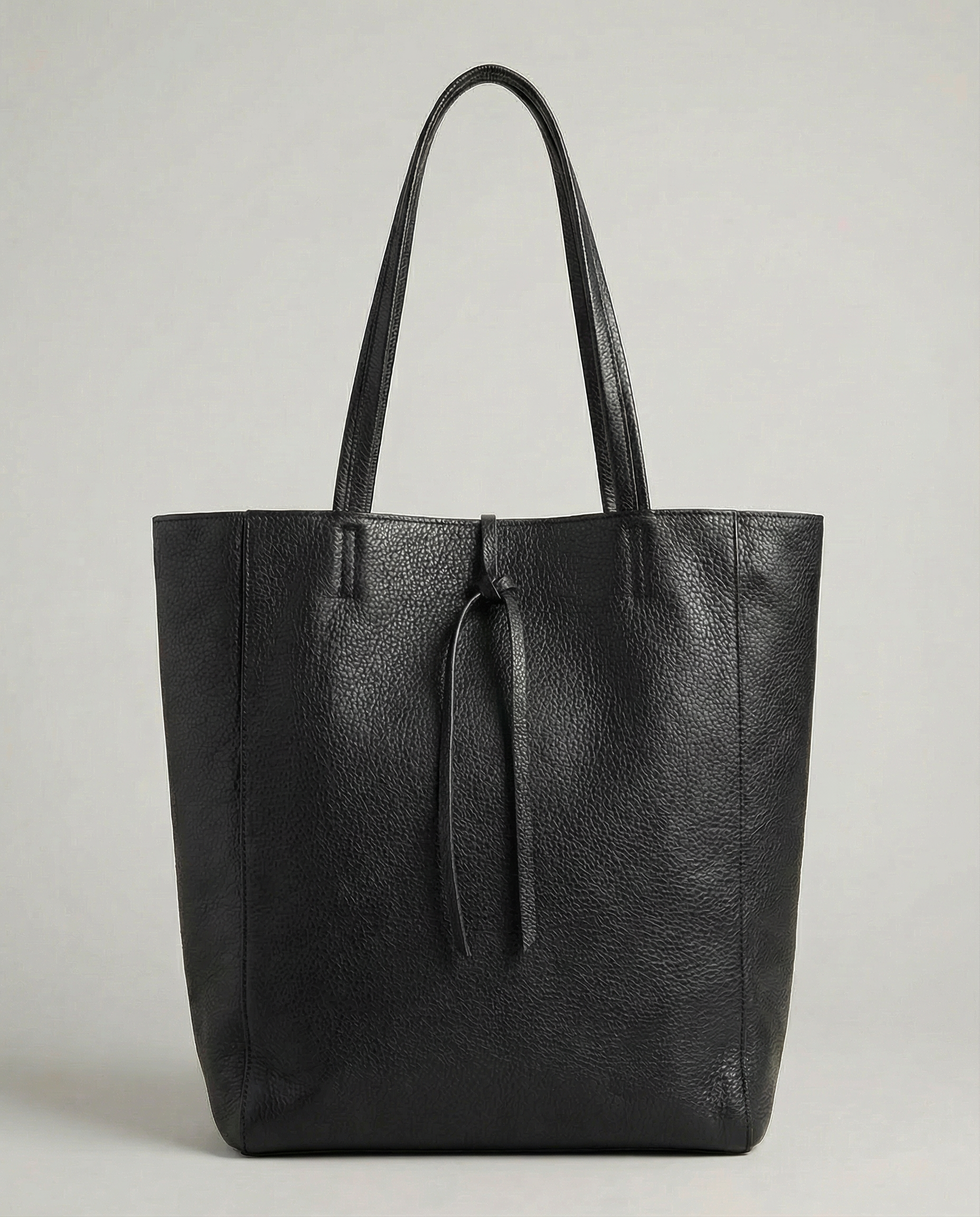 Black pebble leather tote bag available in Tote Bag and Mini Tote sizes. 