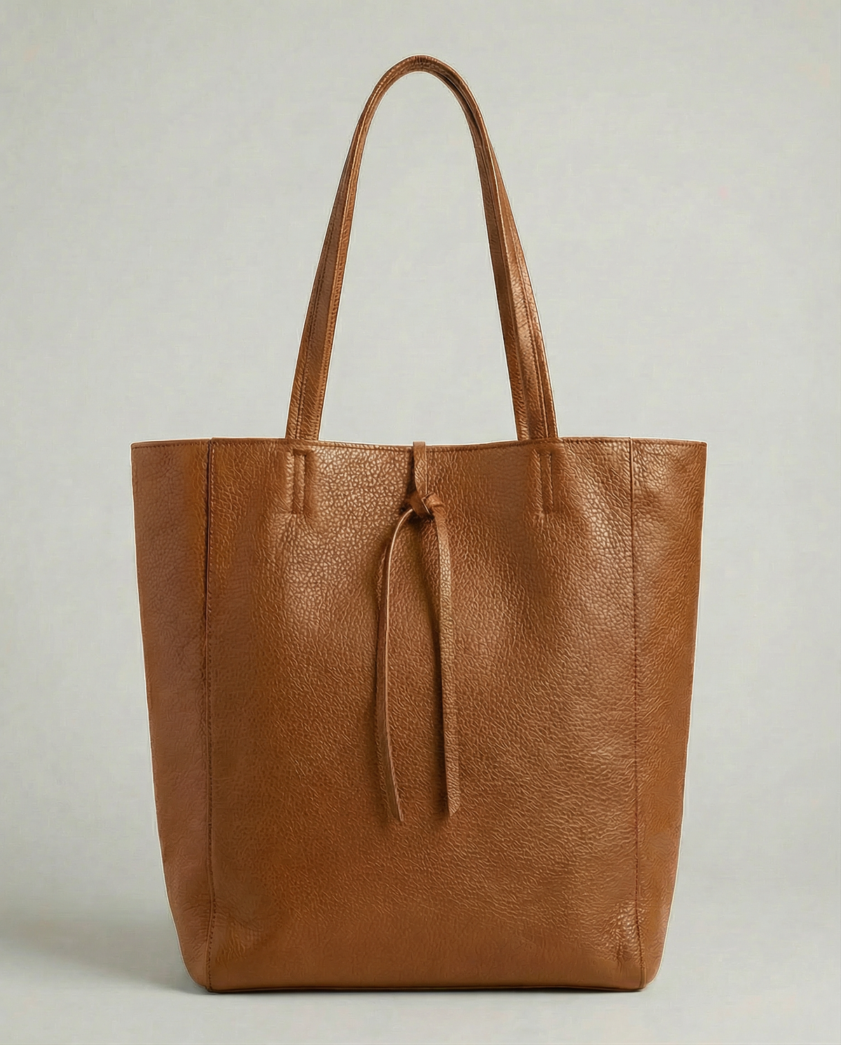 Caramel pebble leather tote bag available in Tote Bag and Mini Tote sizes. 
