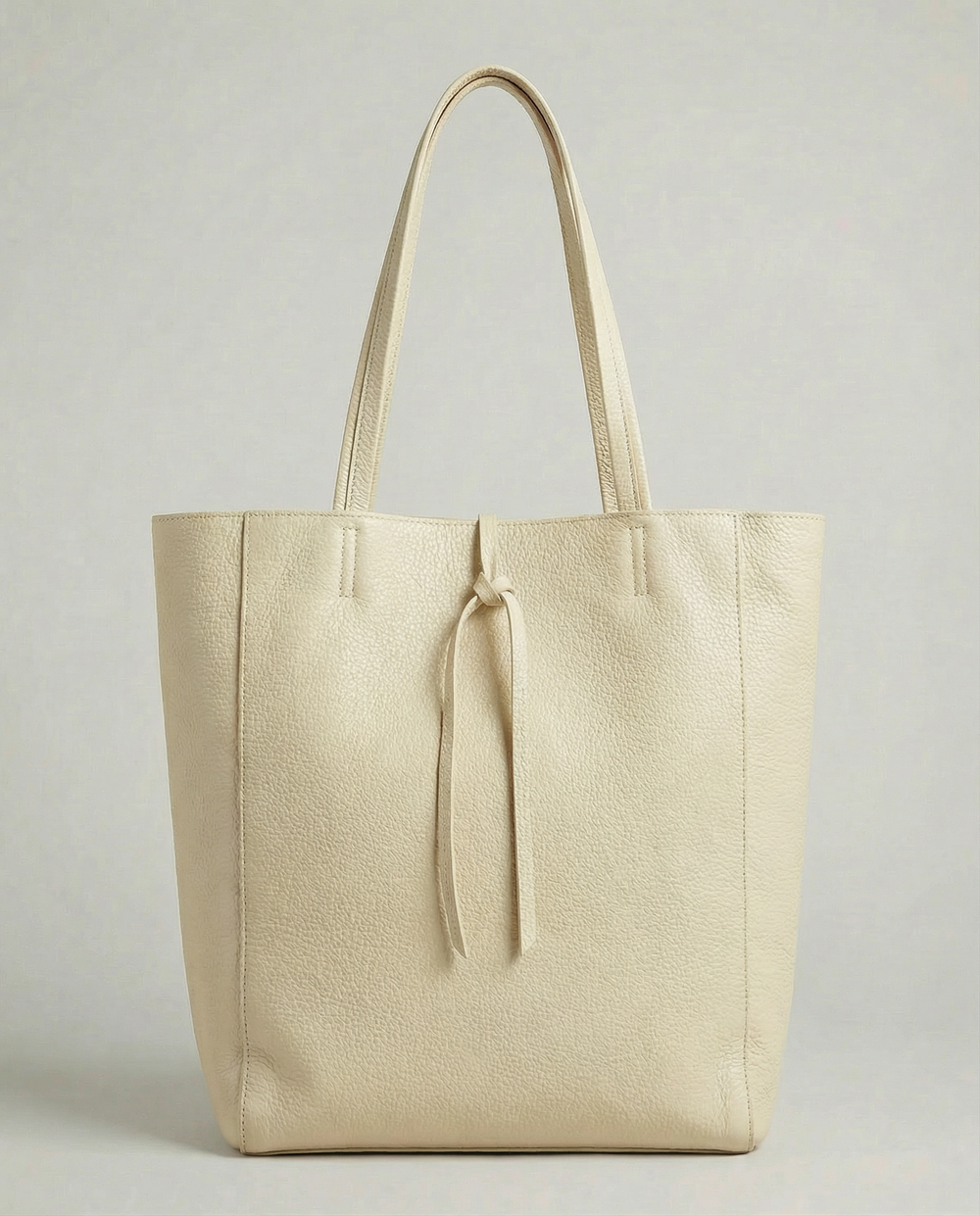 Ivory pebble leather tote bag available in Tote Bag and Mini Tote sizes. 