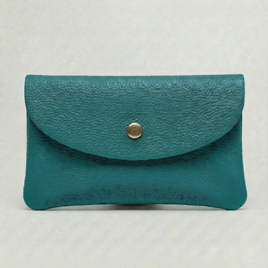 Turquoise pebble leather mini coin wallet with snap closure, compact Italian‑made design for coins and small essentials
