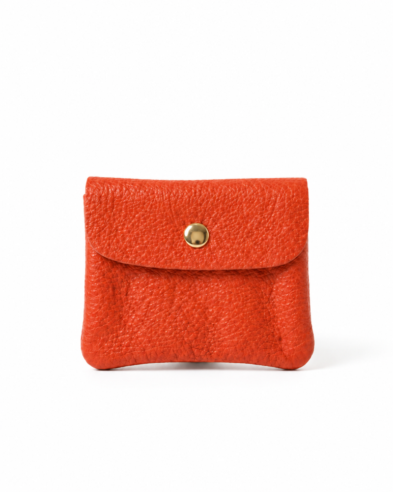 Coral pebble leather wallet collection featuring Mini Coin Wallet, Coin Wallet, and Cellphone Wallet in genuine leather, made in Italy.