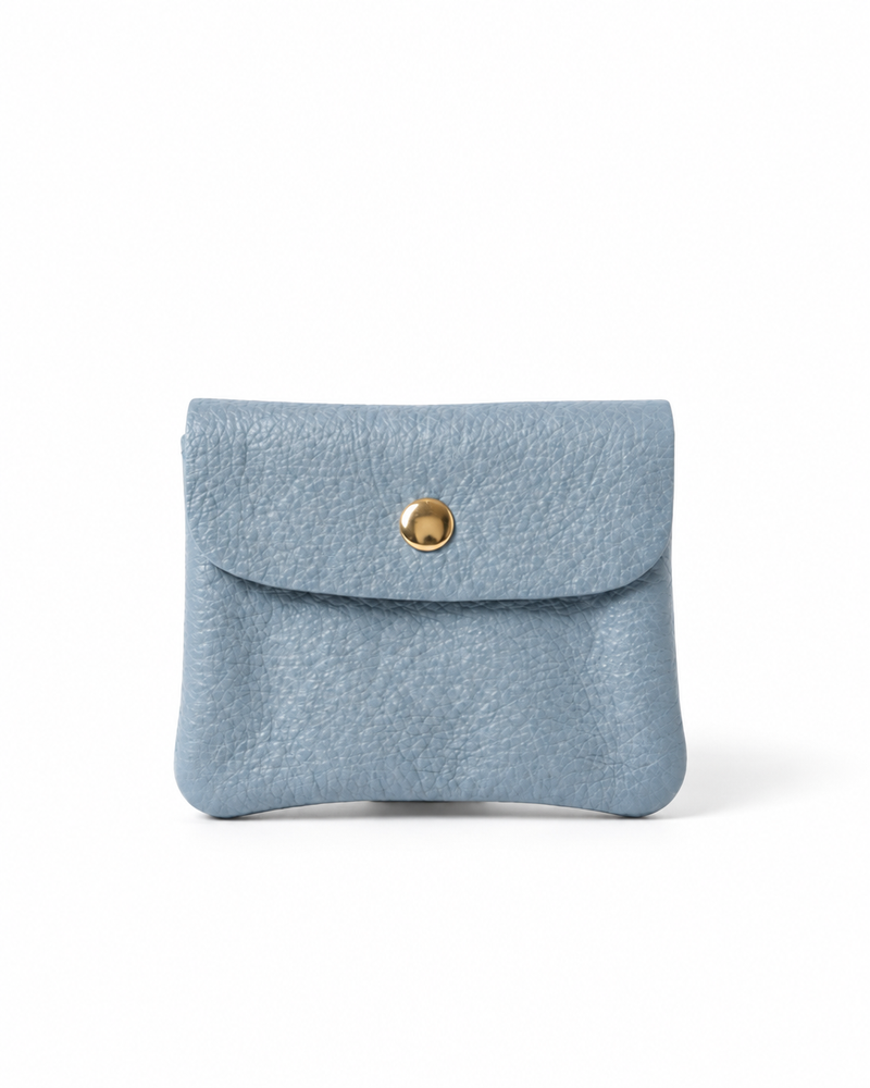 Light Blue pebble leather wallet collection featuring Mini Coin Wallet, Coin Wallet, and Cellphone Wallet in genuine leather, made in Italy.