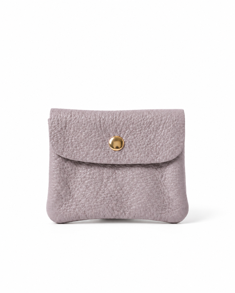 Lilac pebble leather wallet collection featuring Mini Coin Wallet, Coin Wallet, and Cellphone Wallet in genuine leather, made in Italy.