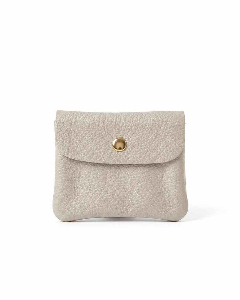 Platinum pebble leather wallet collection featuring Mini Coin Wallet, Coin Wallet, and Cellphone Wallet in genuine leather, made in Italy.