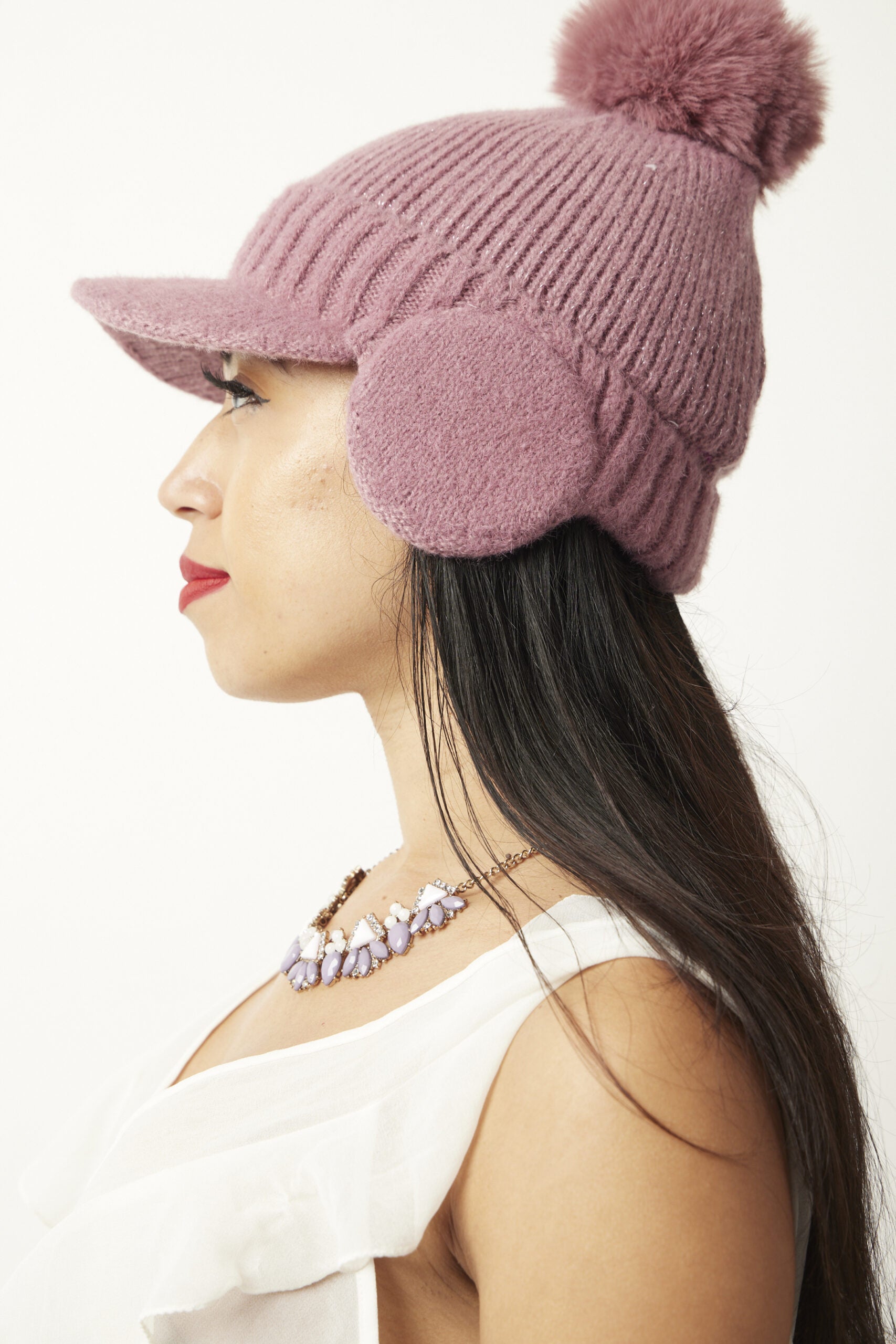 Woman wearing Pink Chiara beanie side view