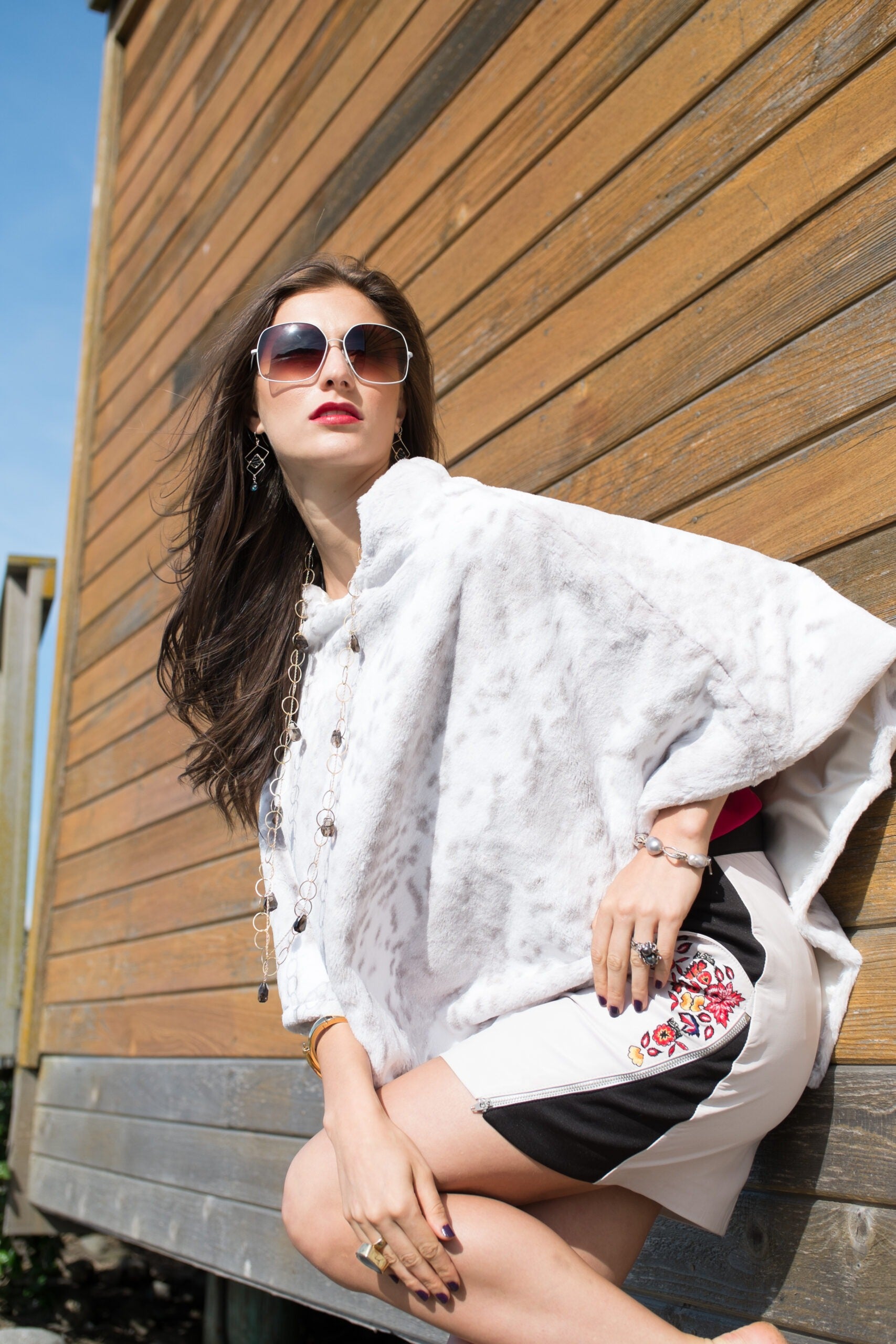 Side view Woman wearing a Snow Grey Leopard Poncho
