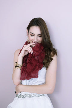 Woman posing wearing Moroccan Long Scarf in Garnet, view 2