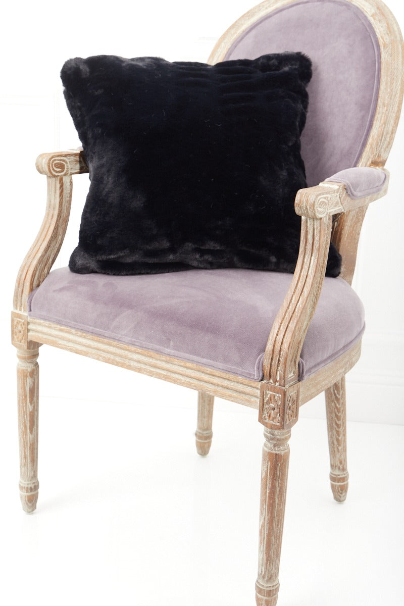 Black Florence Pillow on a pink chair side view
