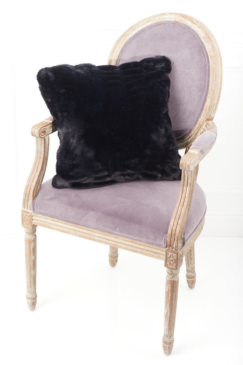 Black Florence Pillow on a pink chair 
