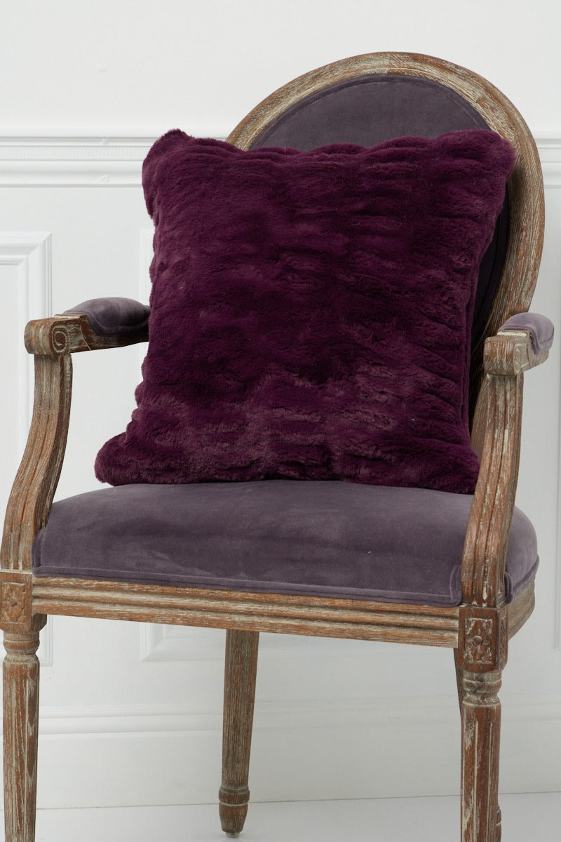 Plum Florence Pillow on a chair