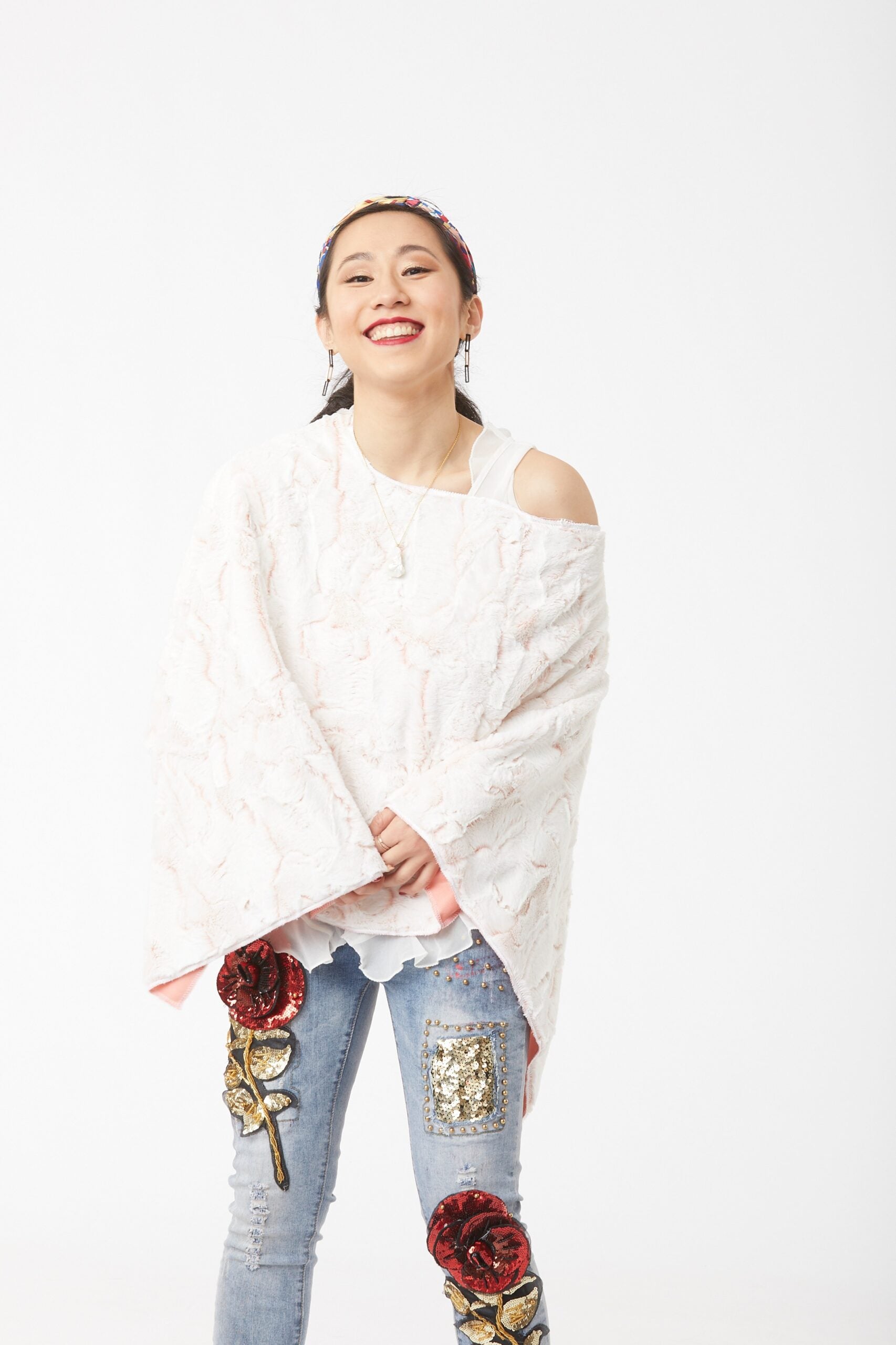 Woman wearing Cream and Blush Lux Rabbit Duo Tone Poncho front view