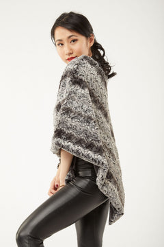 Side view of woman wearing a Paloma Poncho – Chocolate and Black Color, view 4