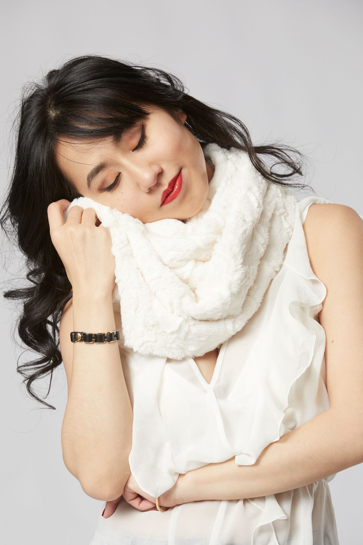 Woman wrapped with Lux Cuddle Scarf in Ivory