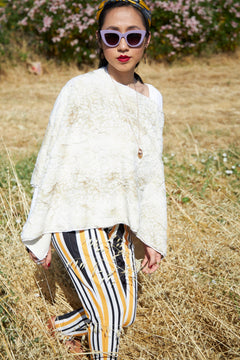 Woman walking wearing Beige Siberian Leopard Poncho, view 3