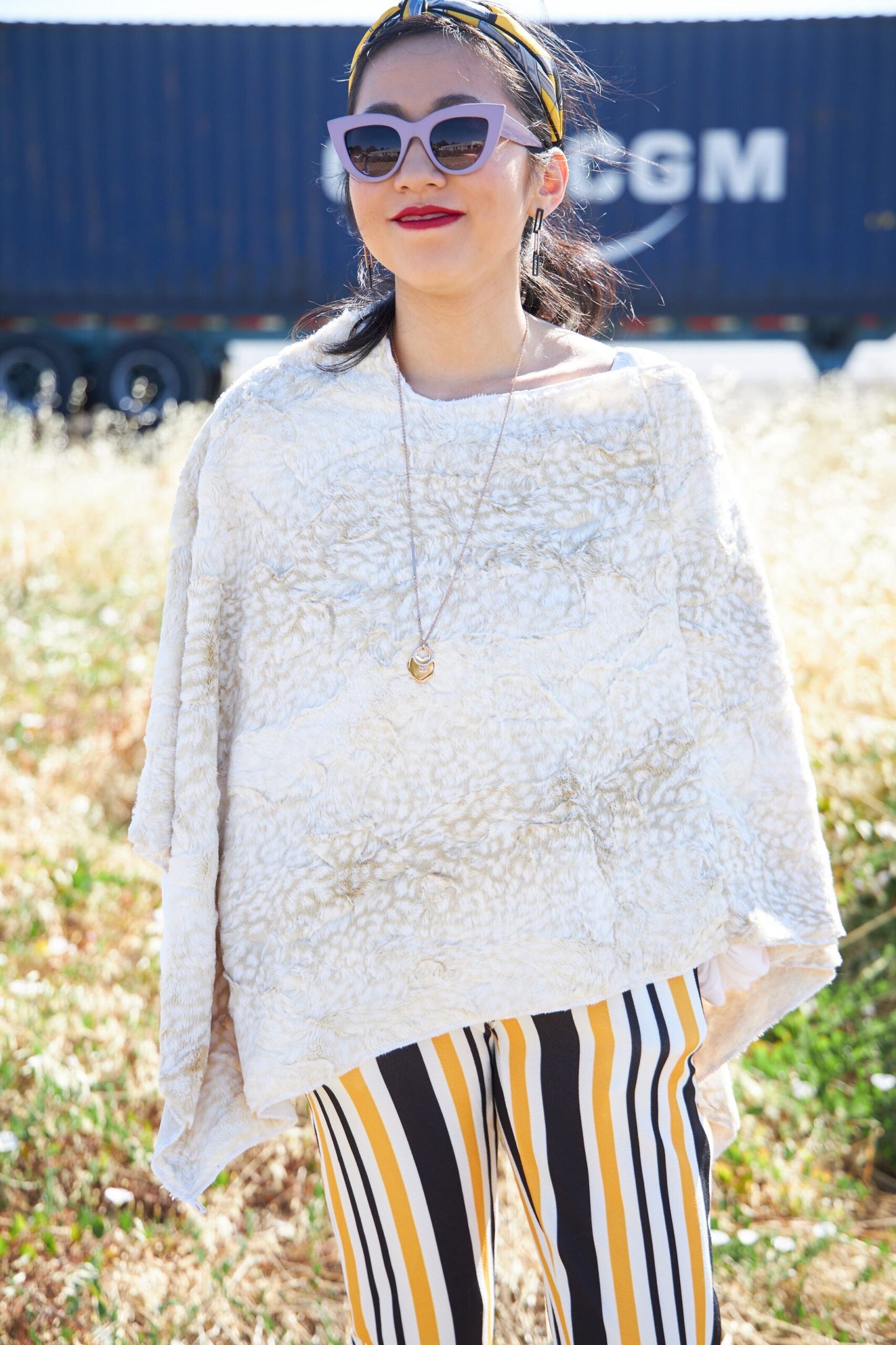 Woman wearing Beige Siberian Leopard Poncho