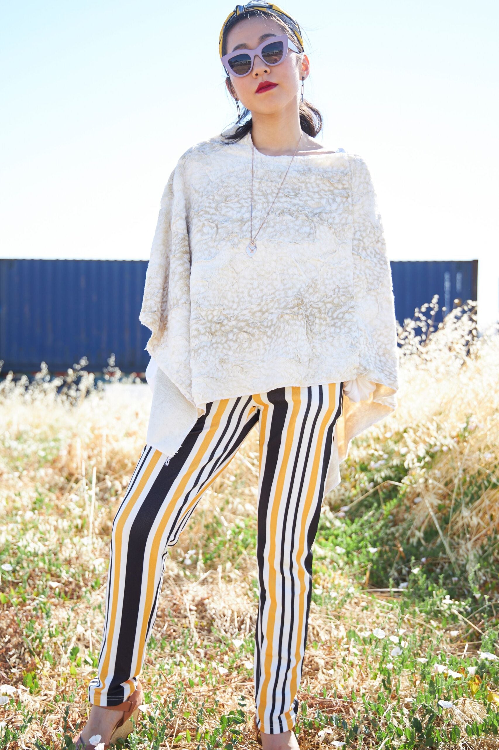 Woman posing wearing Beige Siberian Leopard Poncho