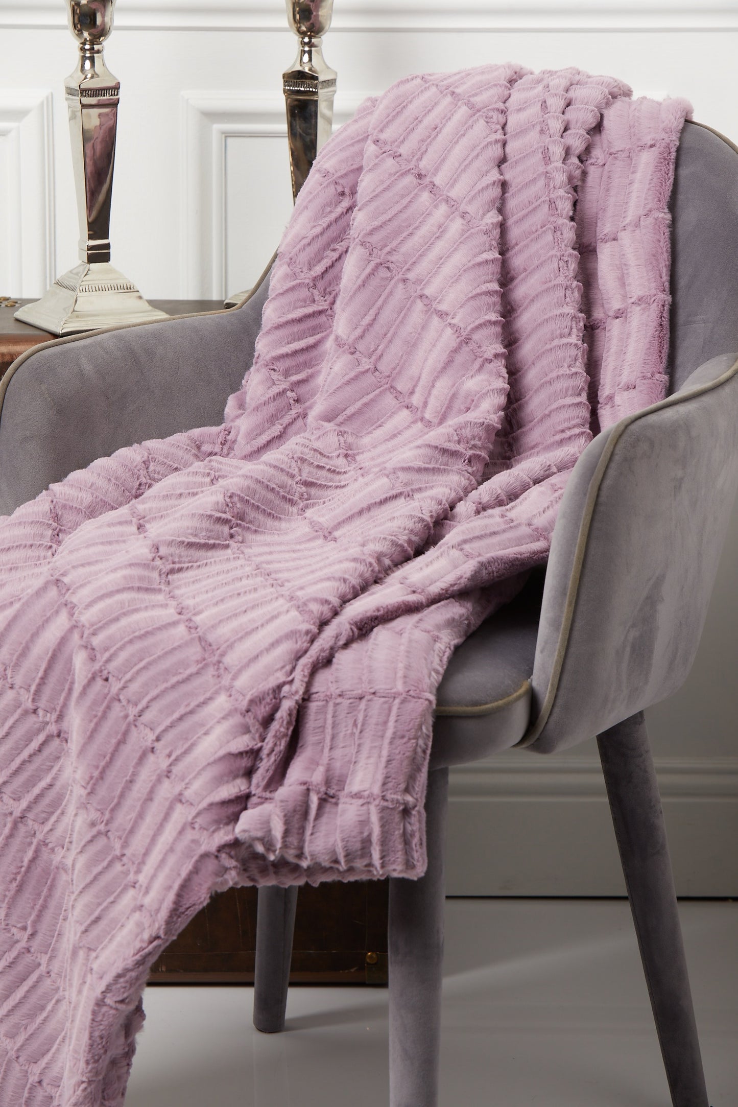 Throw – Versailles Primerose on a gray chair