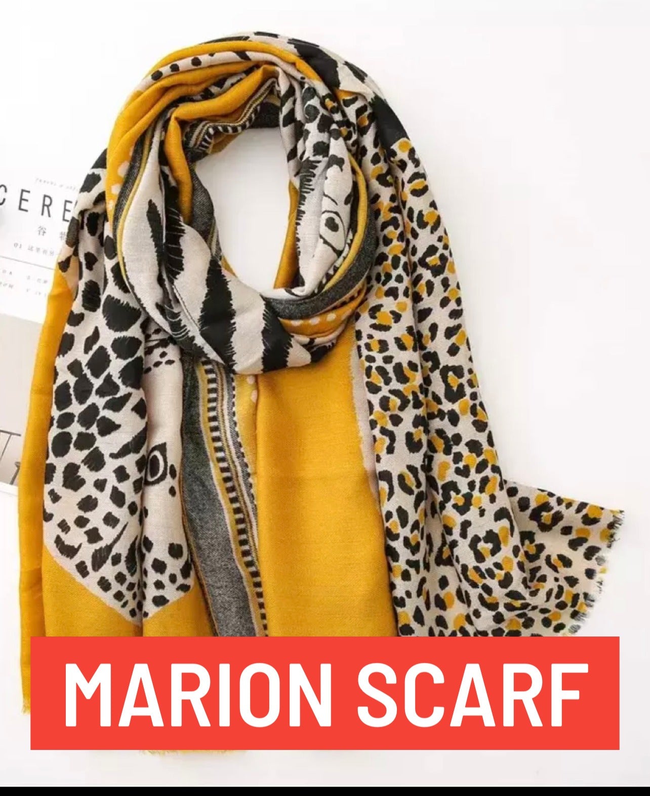 Text Marion Scarf display, yellow and black,. leopard print